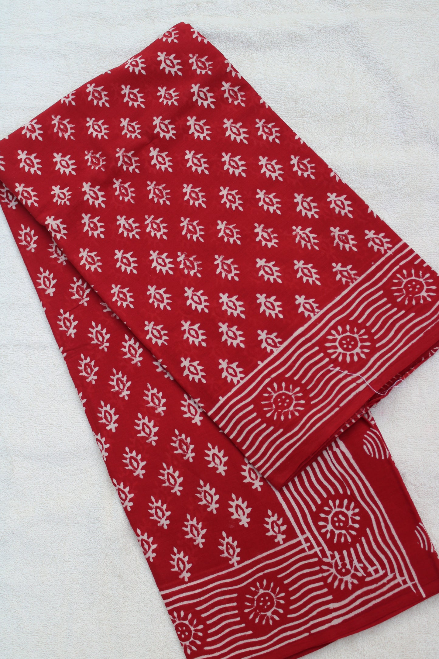 Red block printed mul cotton saree