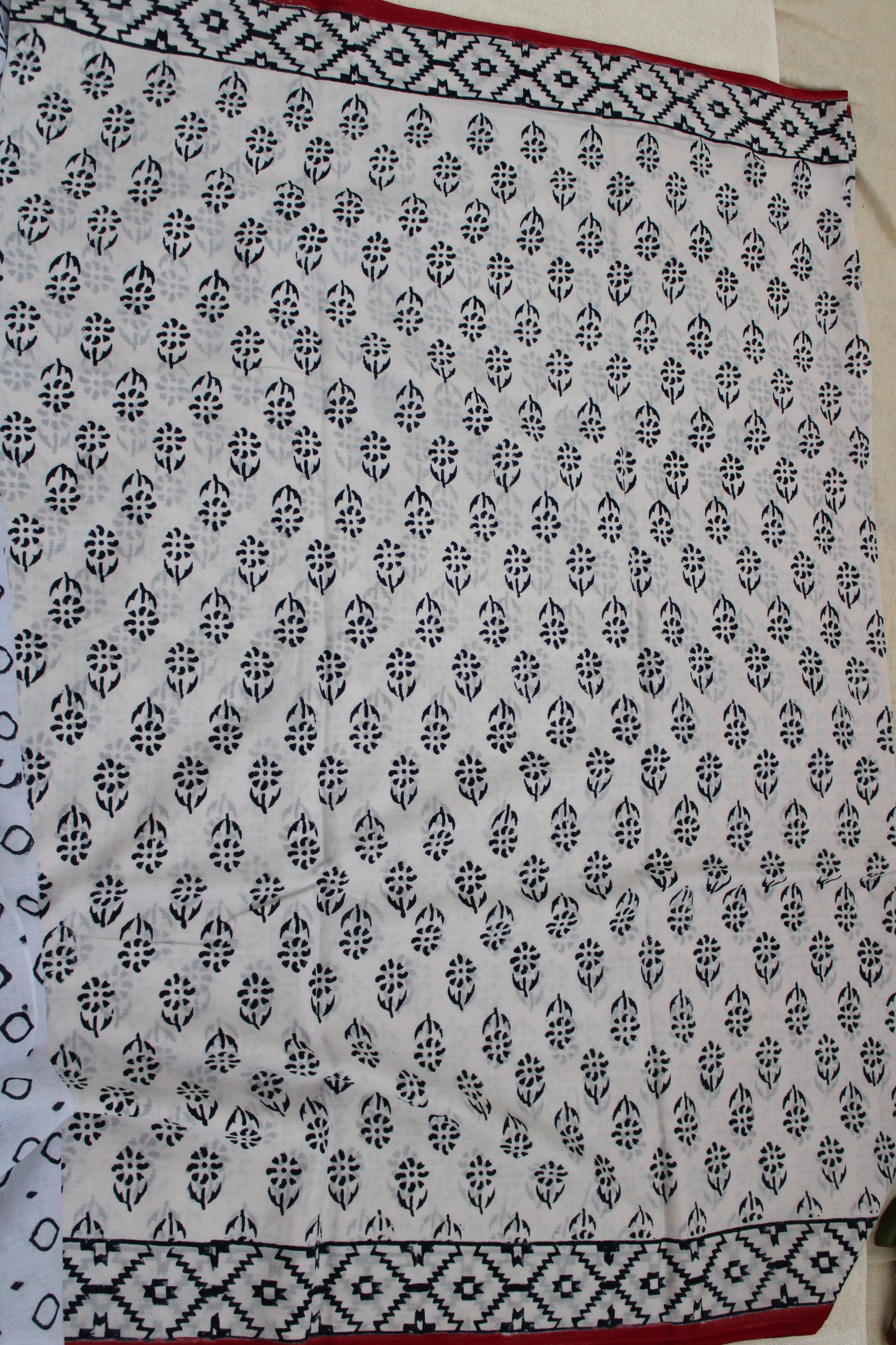White hand block printed mul mul cotton with flower motifs