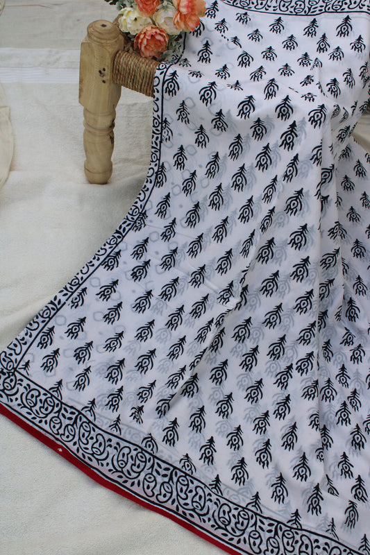 White hand block printed saree with peacock leaf design