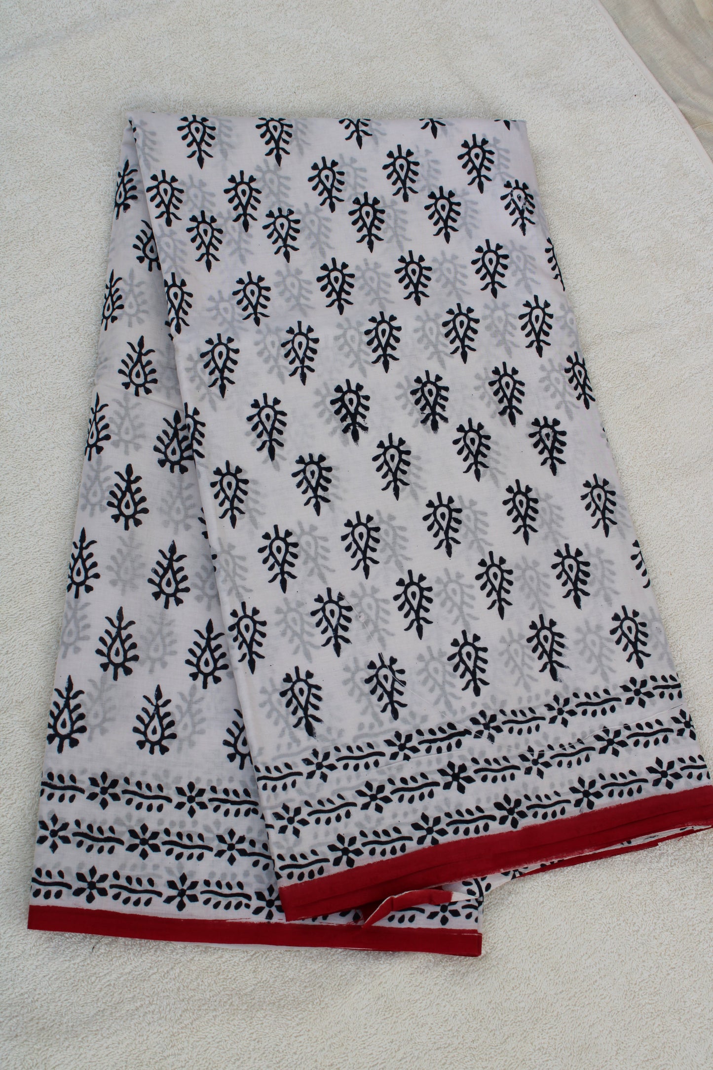 White with black peacock leaf hand block printed mul cotton saree