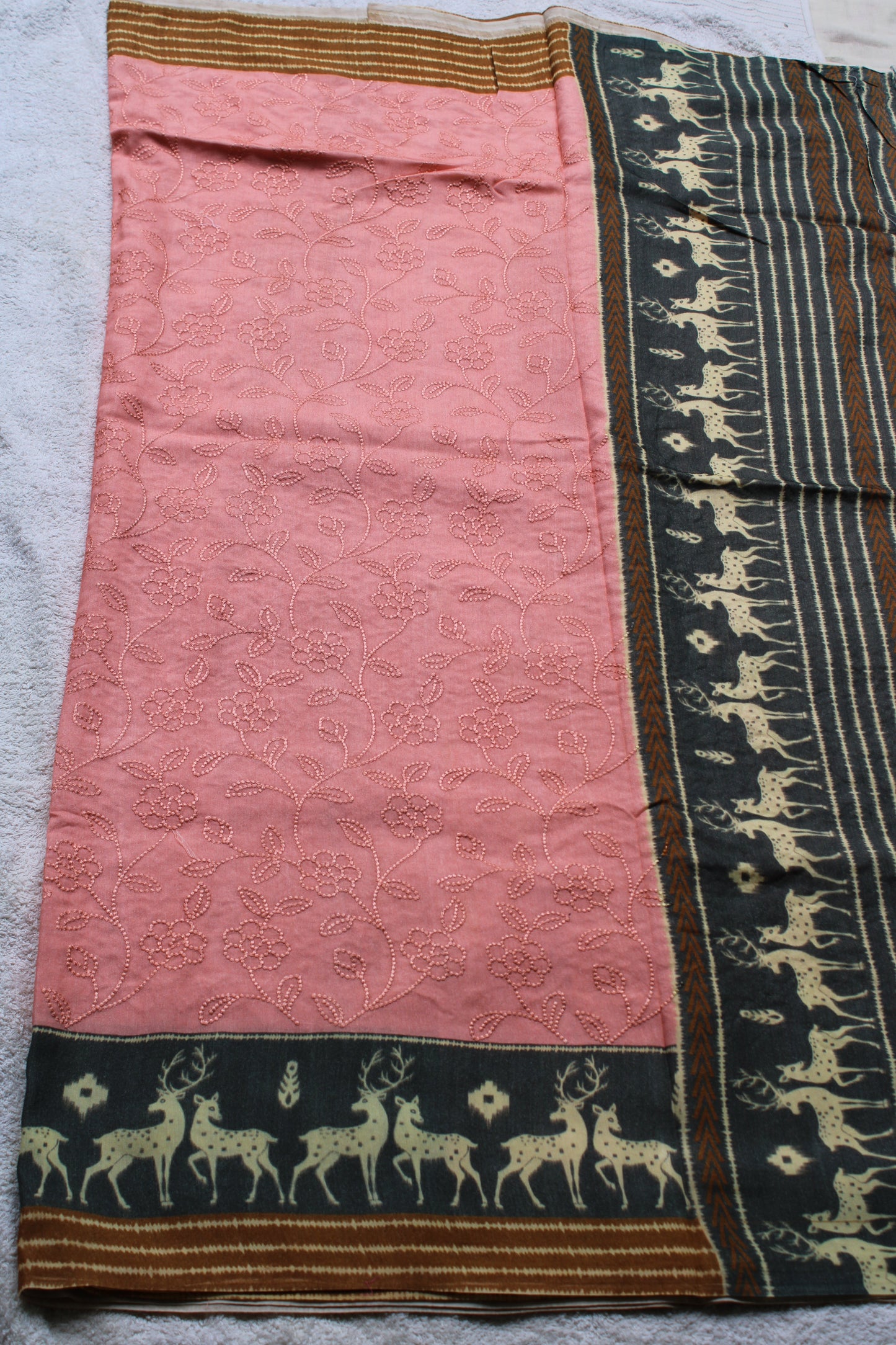 Peach Very soft Tusser crape saree with deer motifs border