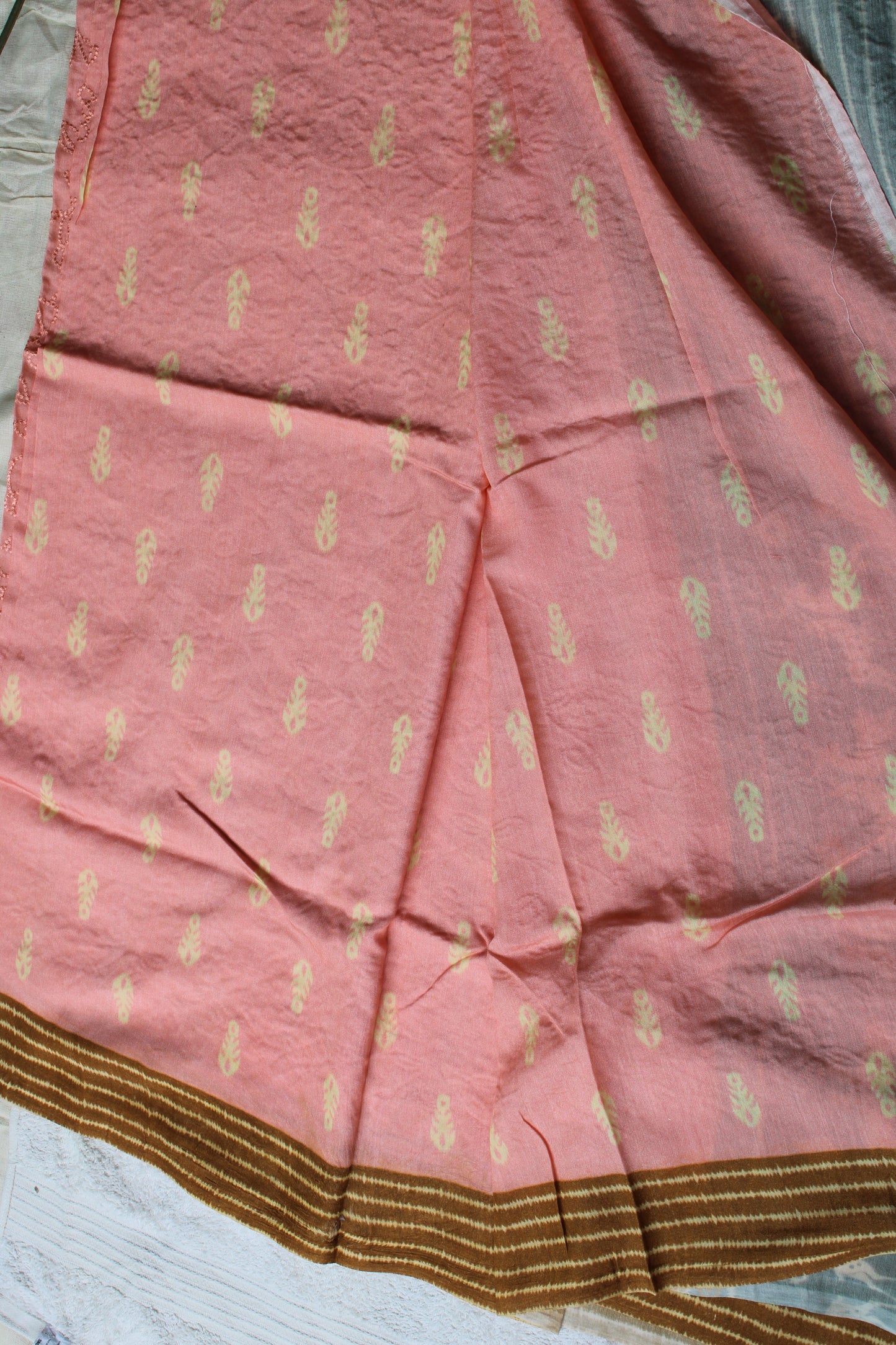 Peach Very soft Tusser crape saree with deer motifs border