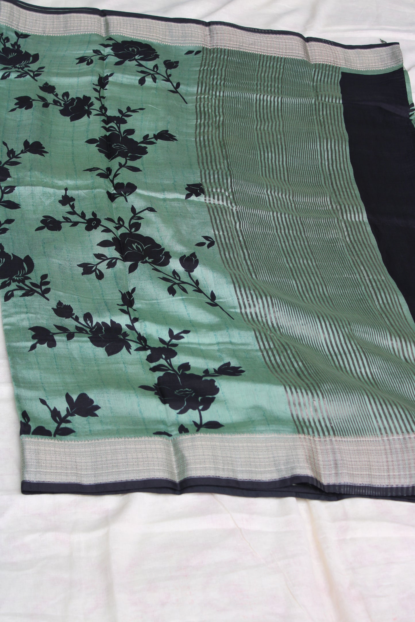 Green Tussur Crape saree with floral design