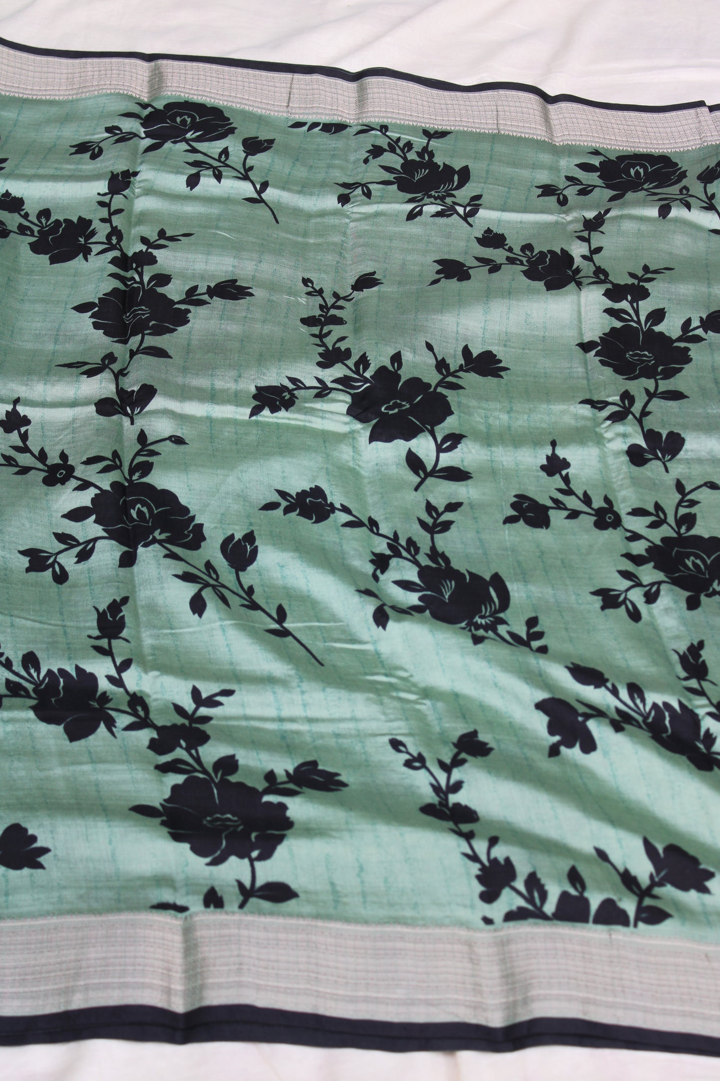Green Tussur Crape saree with floral design