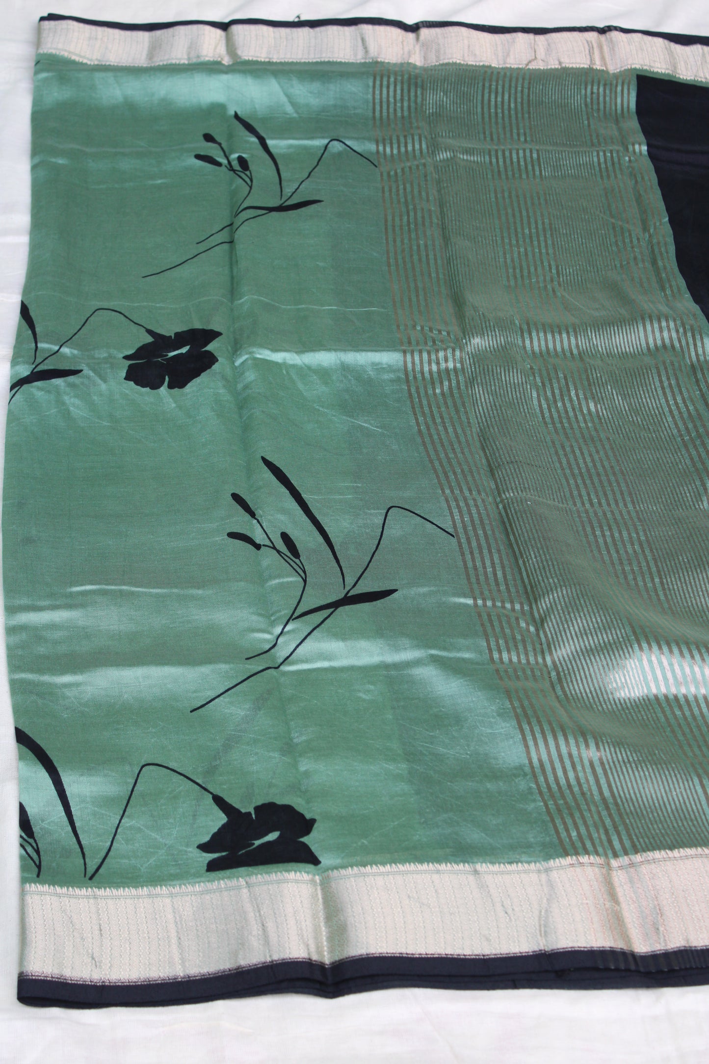Green Tussur Crape saree with floral design