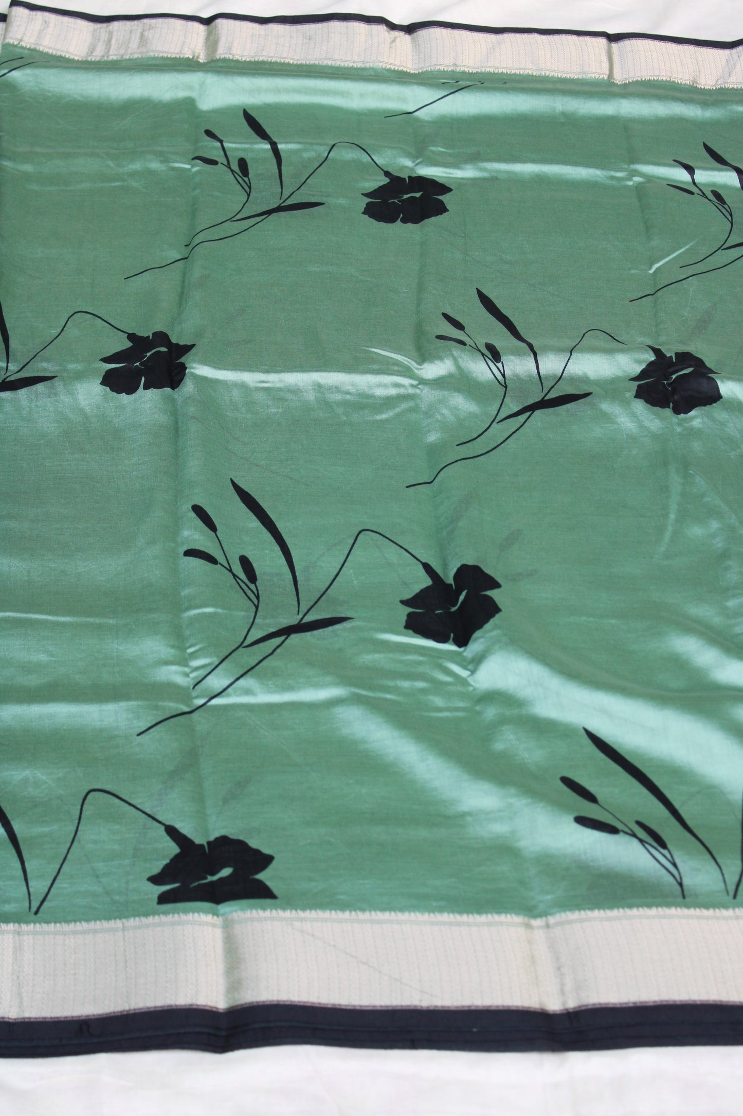 Green Tussur Crape saree with floral design