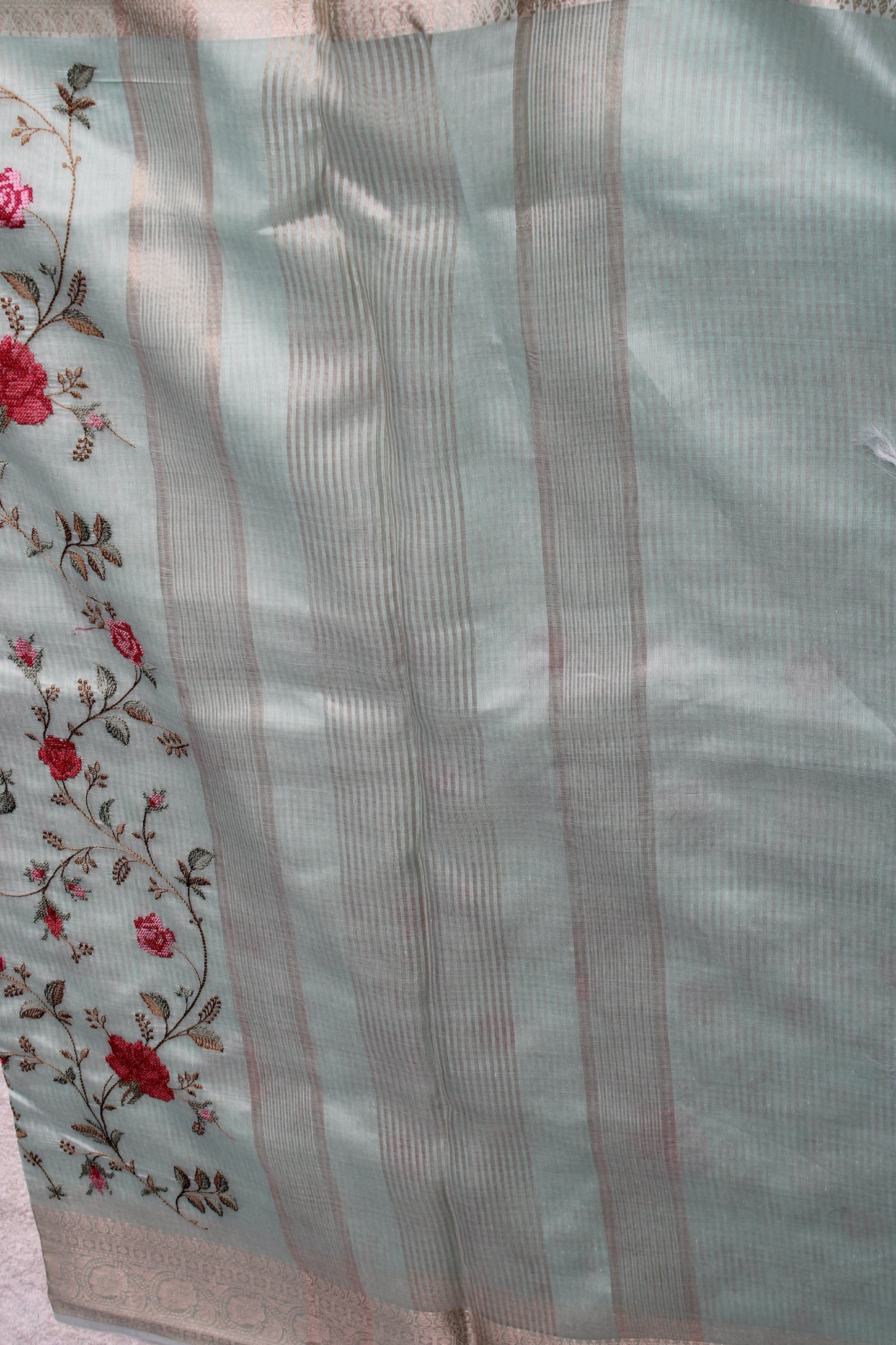 Pastel blue lenin silk saree with Banarasi parsi work and zari border
