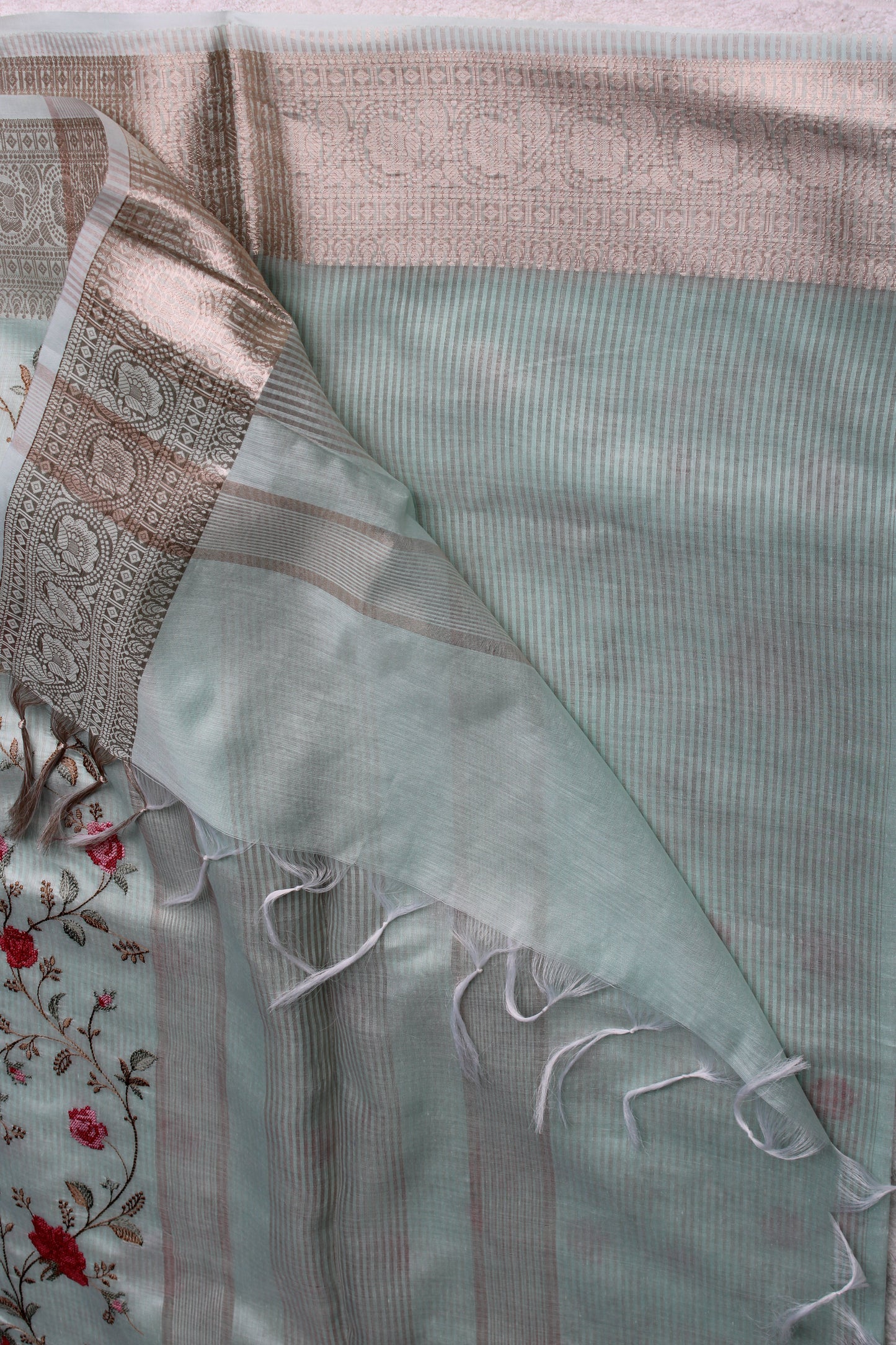 Pastel blue lenin silk saree with Banarasi parsi work and zari border