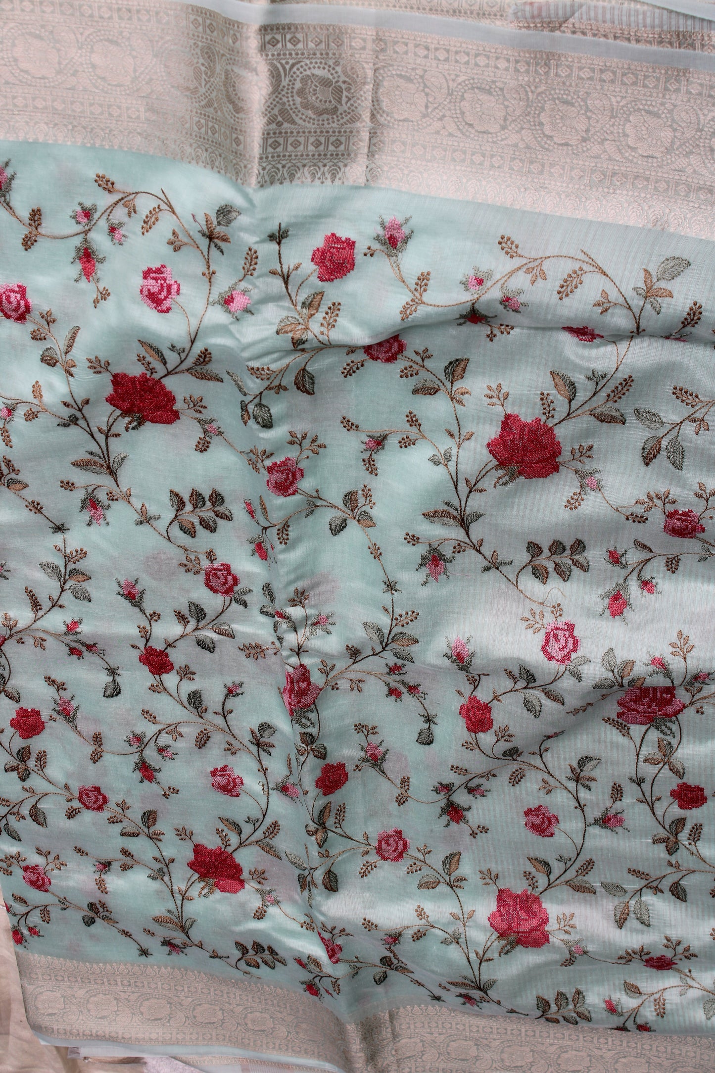 Pastel blue lenin silk saree with Banarasi parsi work and zari border