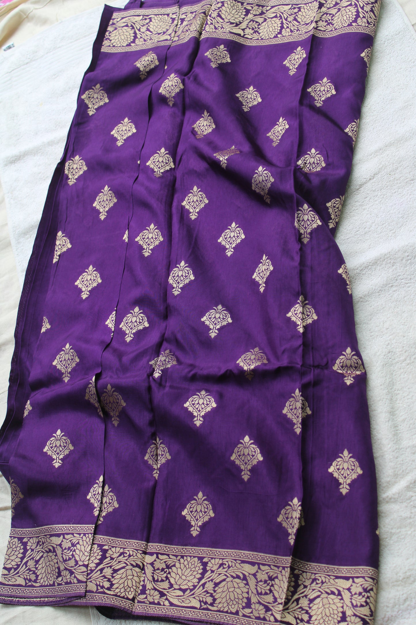 Banarasi purple saree with small trending border and new flower motifs