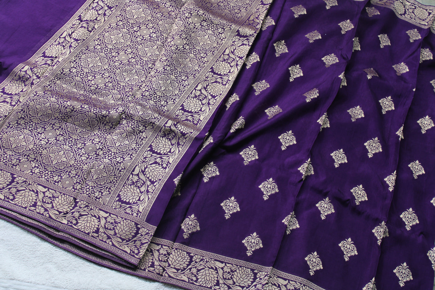 Banarasi purple saree with small trending border and new flower motifs
