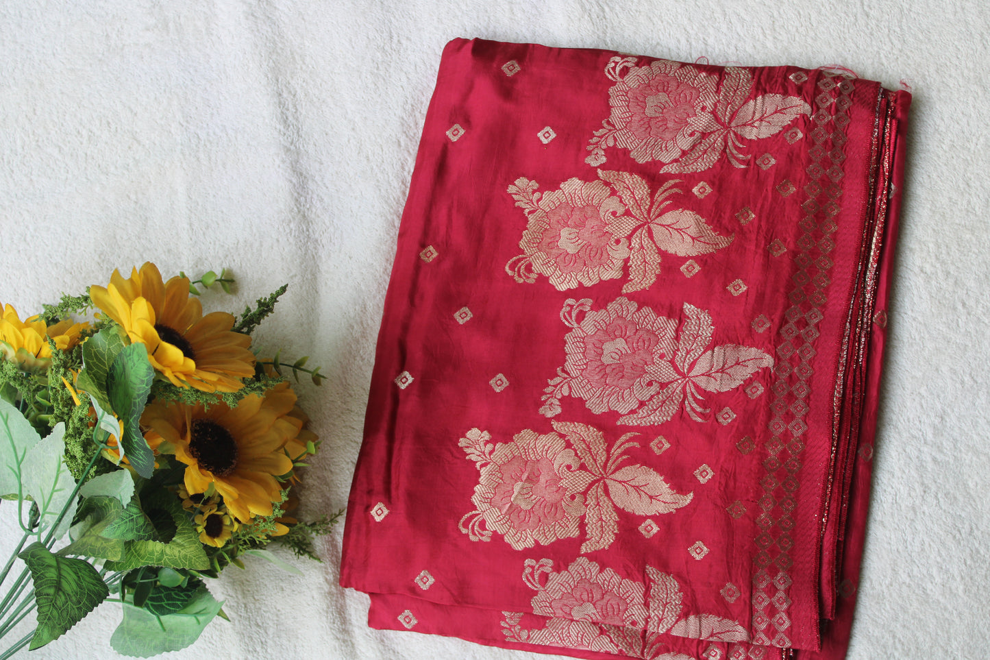 Tomato red Pure crape silk saree with rose flower border
