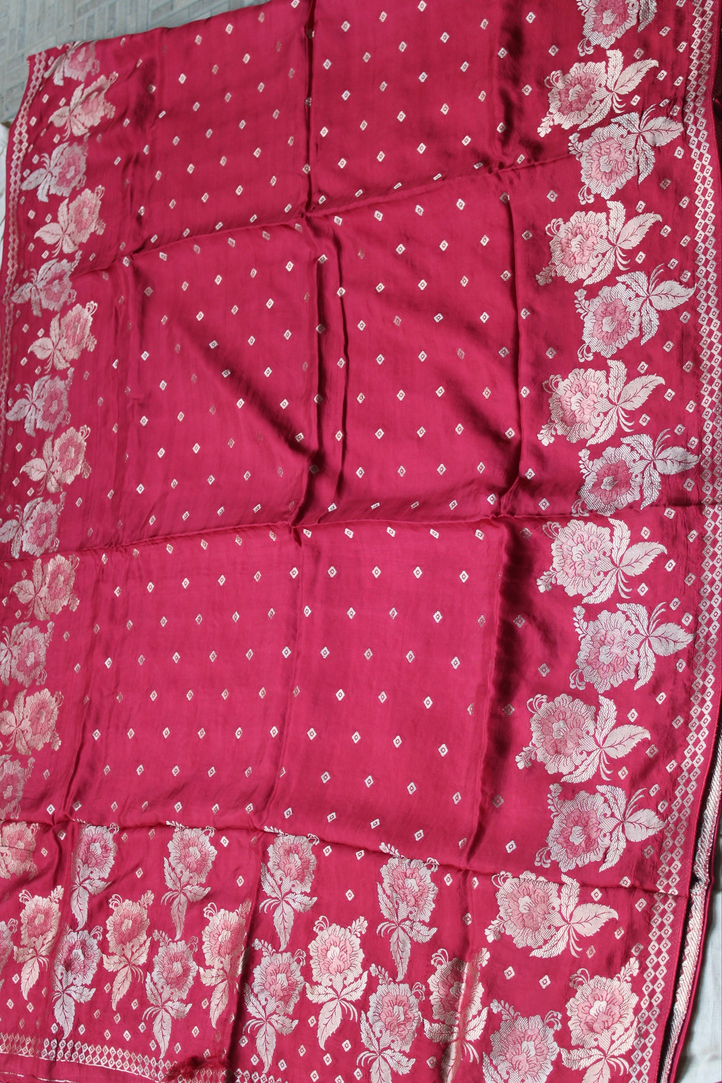 Tomato red Pure crape silk saree with rose flower border