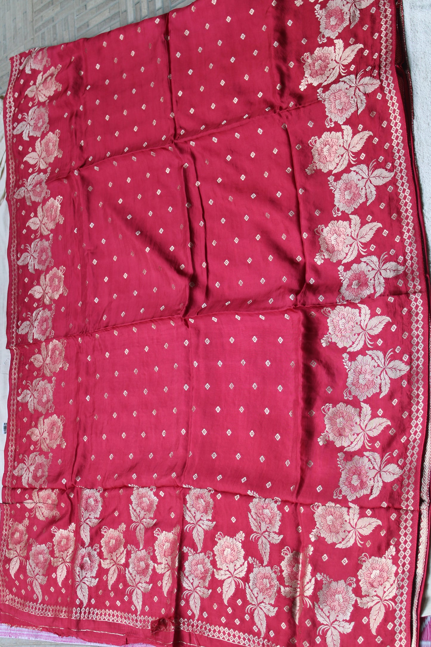 Tomato red Pure crape silk saree with rose flower border