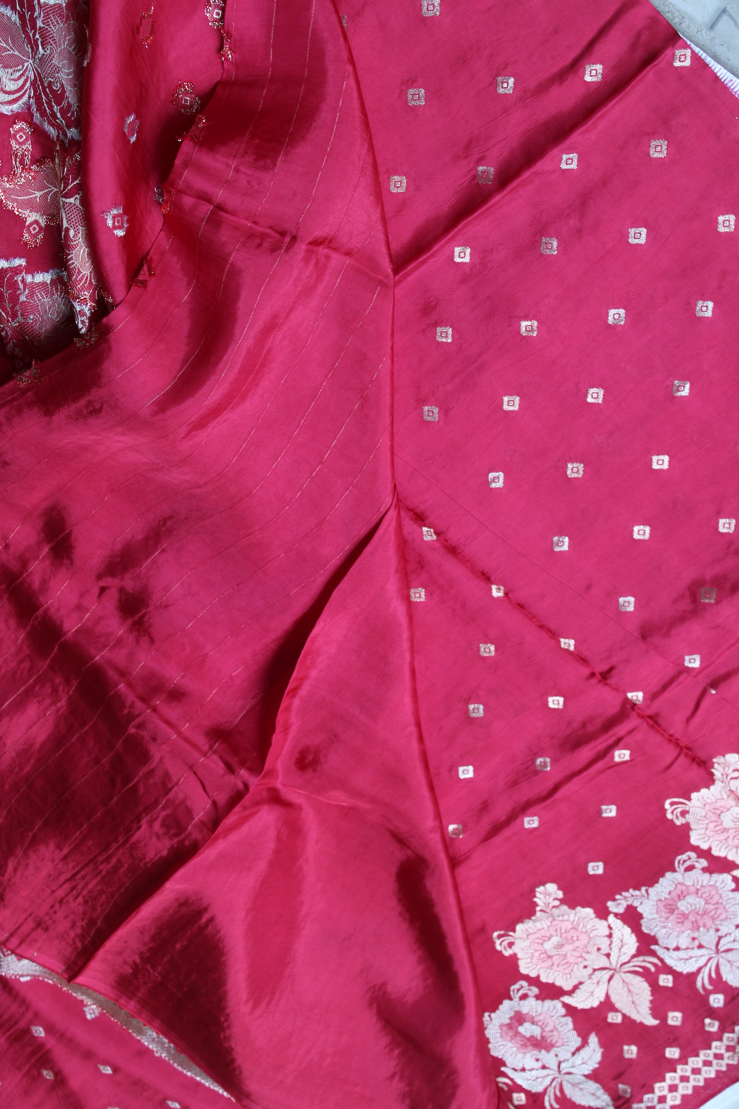 Tomato red Pure crape silk saree with rose flower border