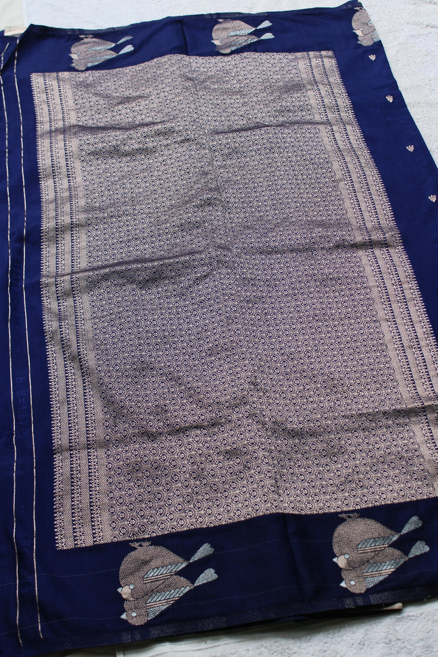 Blue Mona silk saree with figure motifs and open border