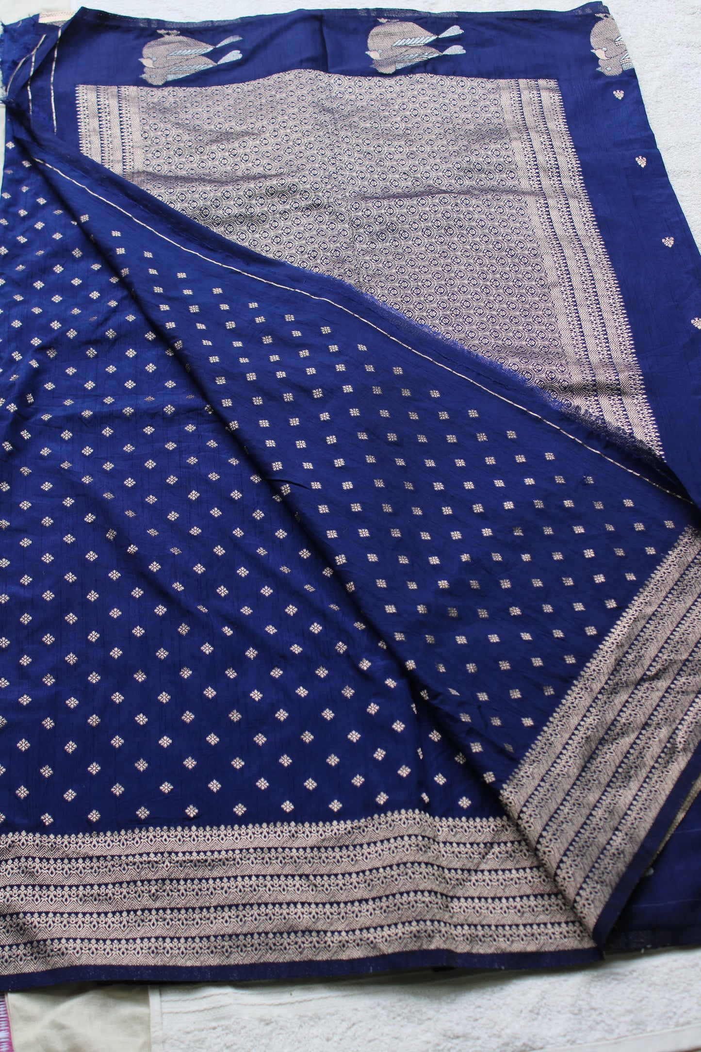 Blue Mona silk saree with figure motifs and open border