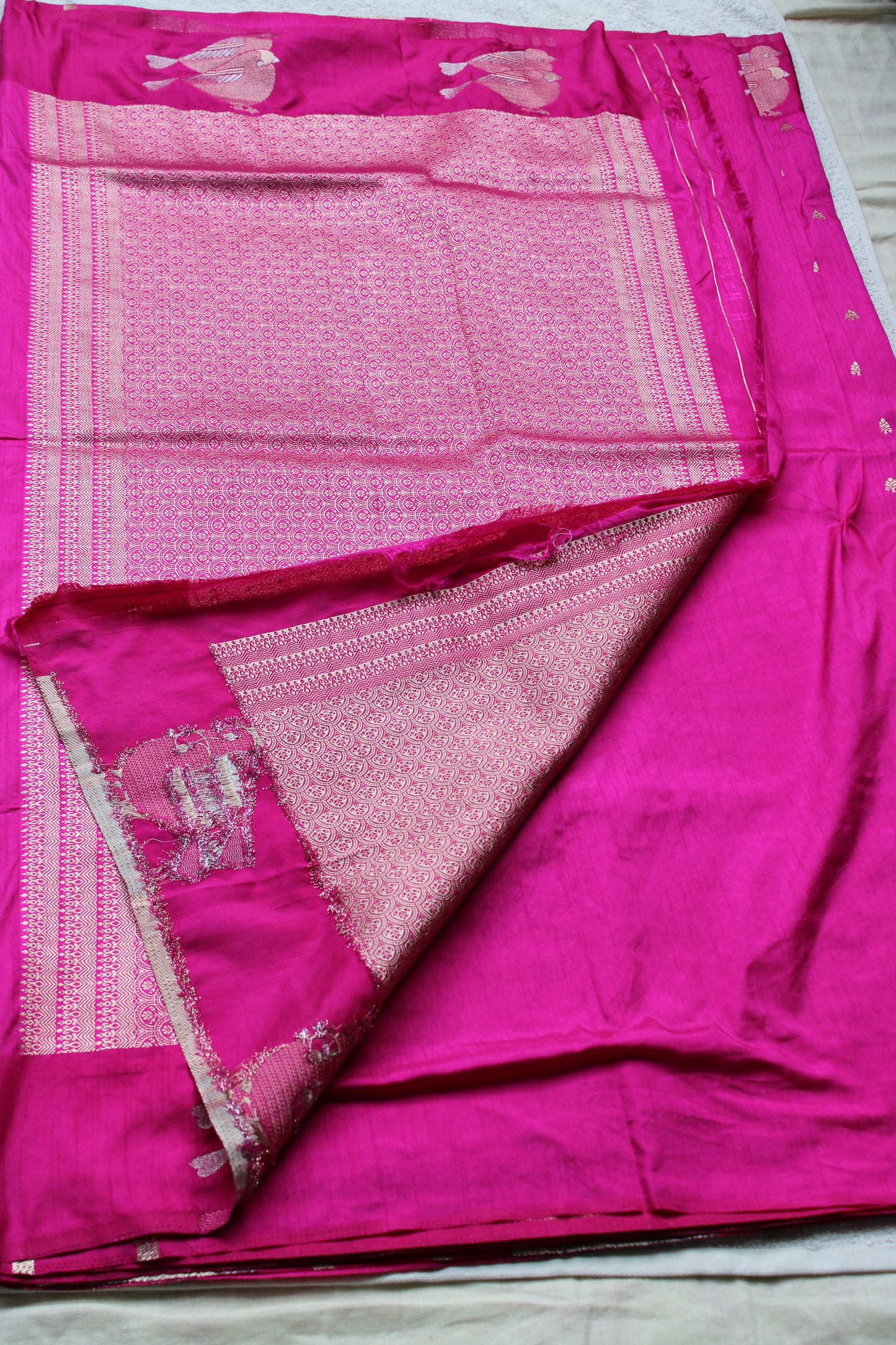Pink Mona silk saree with figure motifs and open border