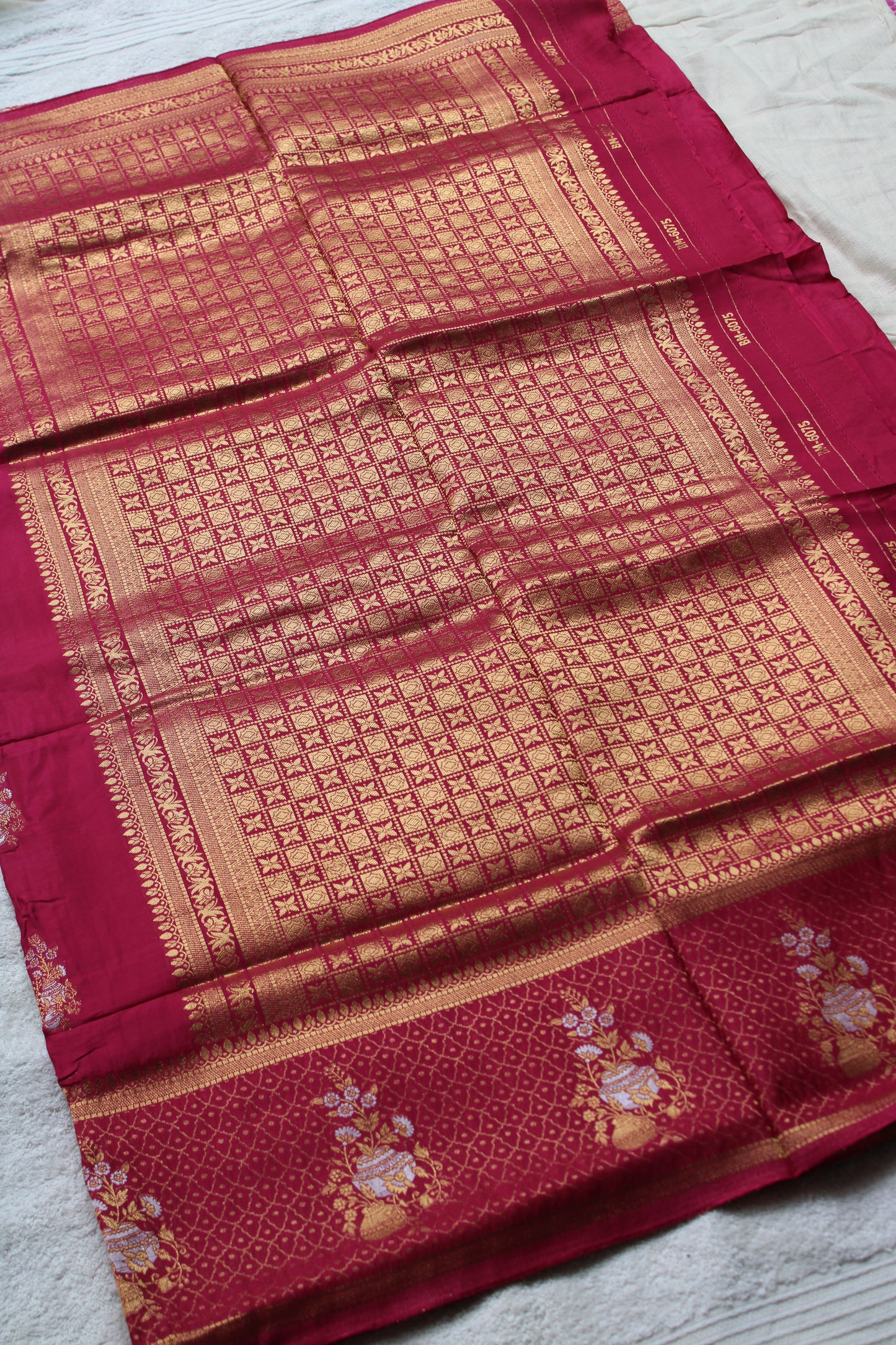 Pink Banarasi Russian crape saree with checked and floral border