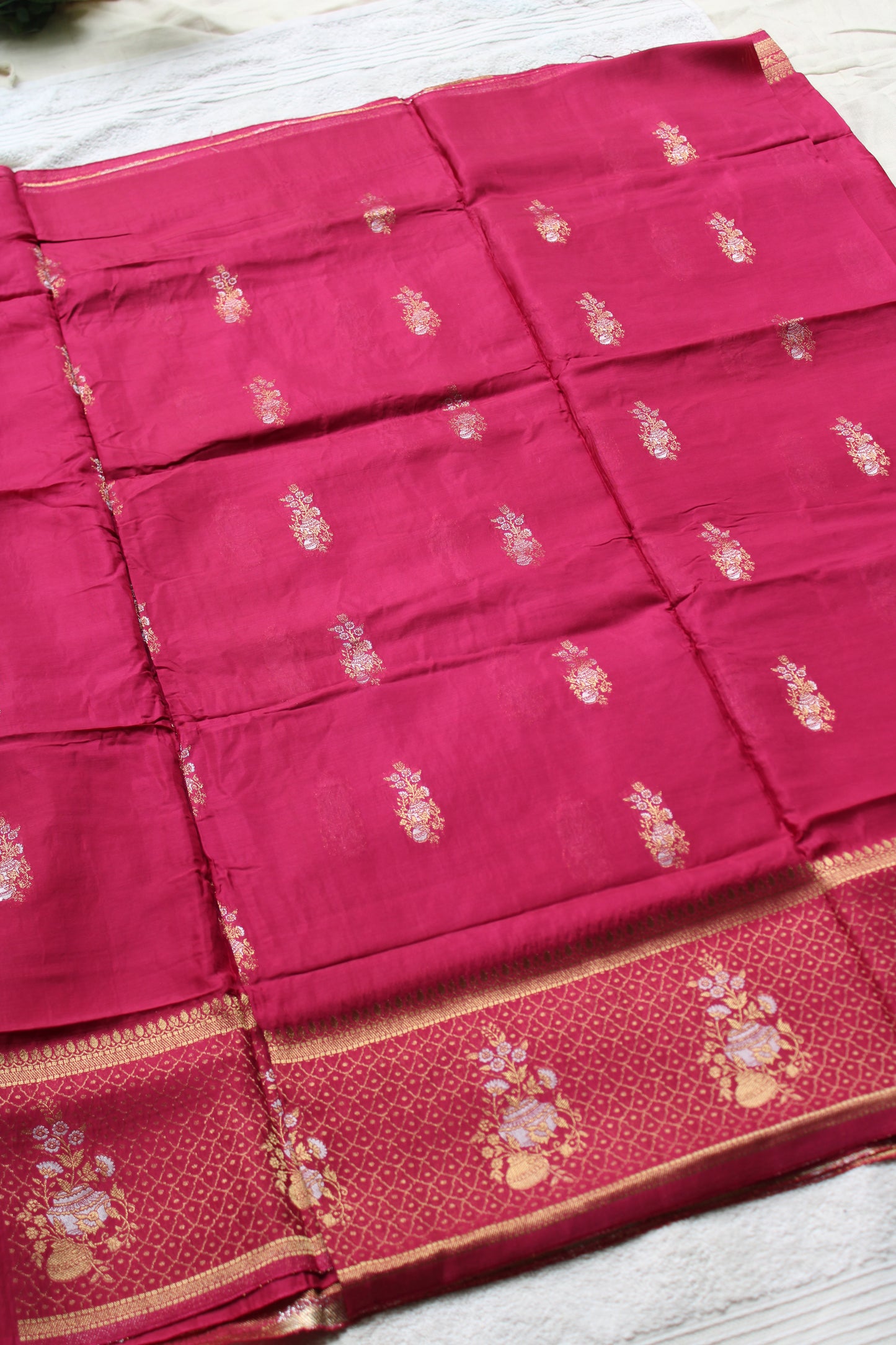 Pink Banarasi Russian crape saree with checked and floral border