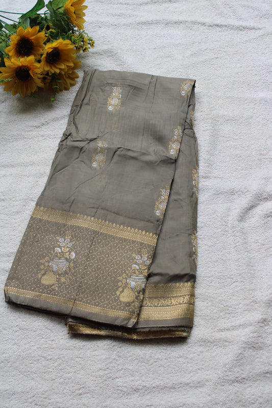 Ash green Banarasi Russian crape saree with checked and floral border
