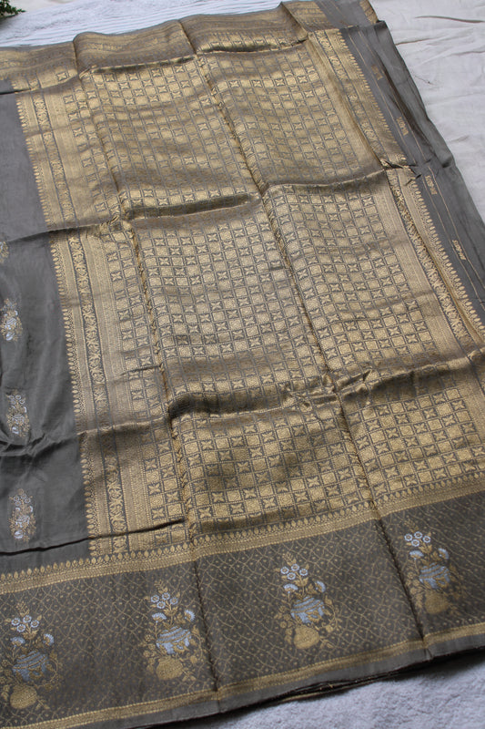 Ash green Banarasi Russian crape saree with checked and floral border