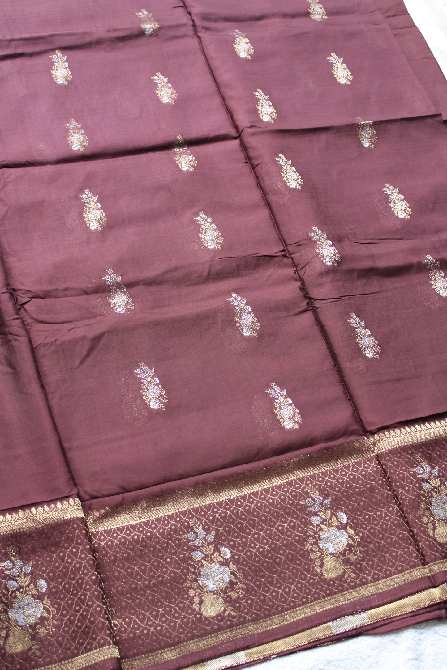 Chocolate Brown Banarasi Russian crape saree with checked and floral border