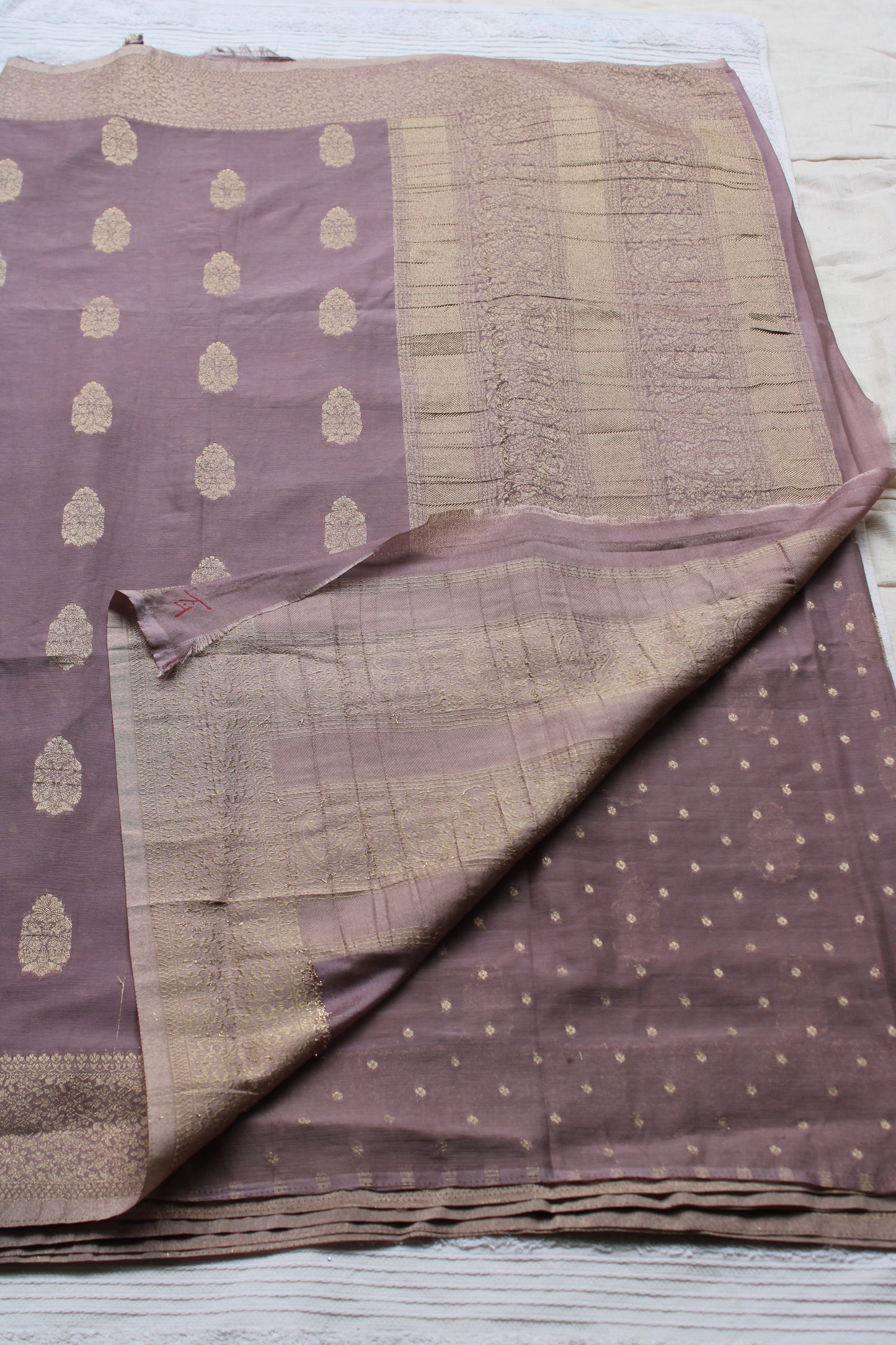 Mauve Banarasi Russian crape saree with checked and floral border