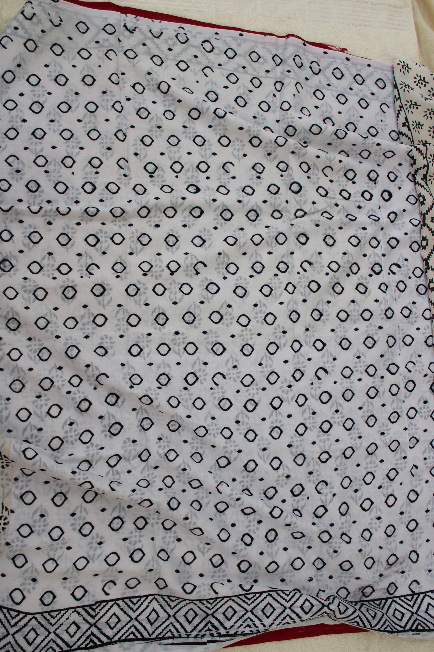 White hand block printed mul mul cotton with flower motifs