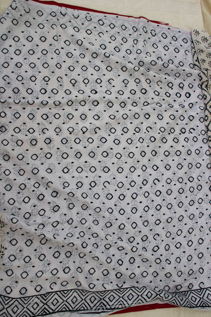 White hand block printed mul mul cotton with flower motifs