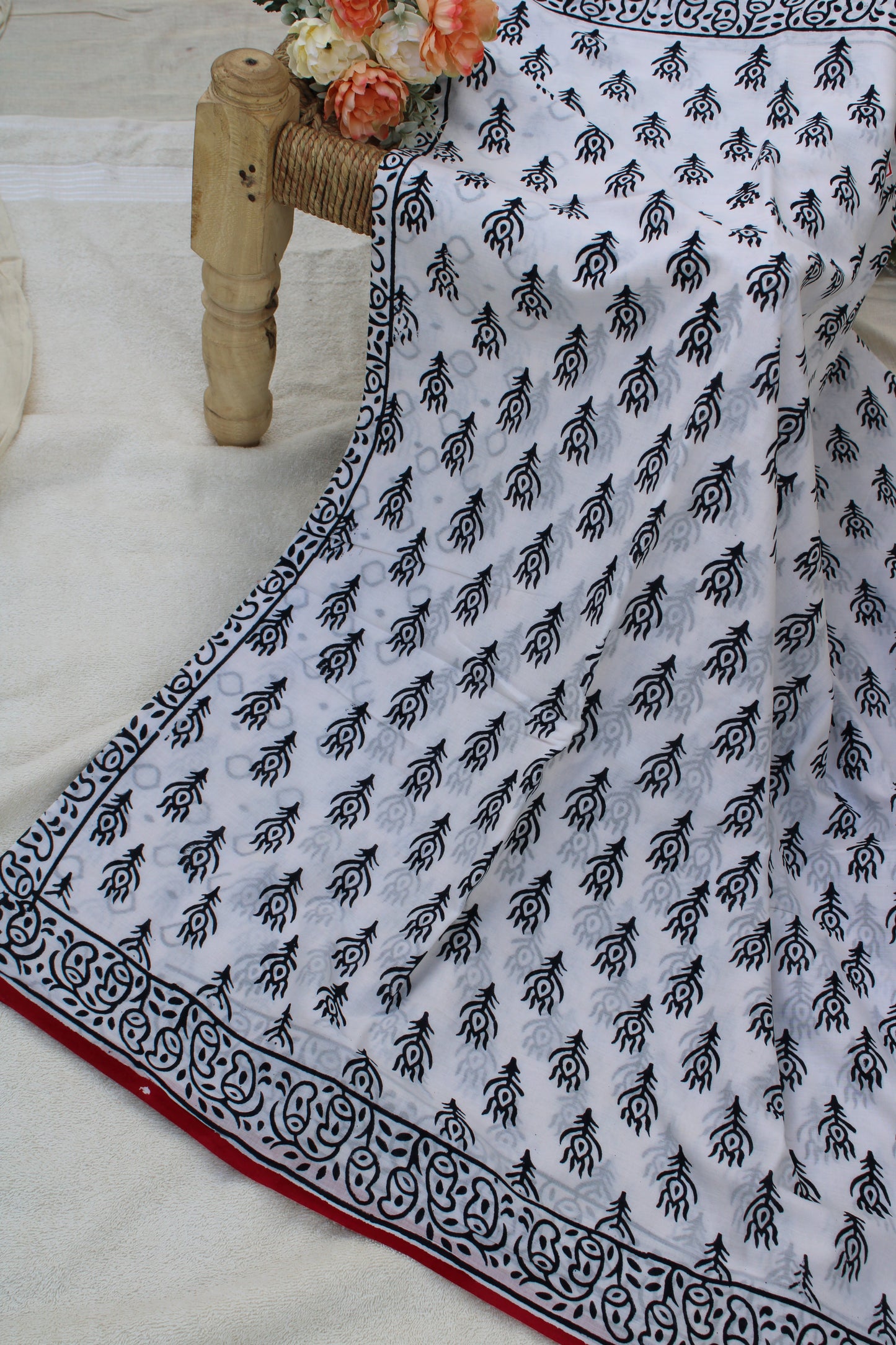White hand block printed saree with peacock leaf design