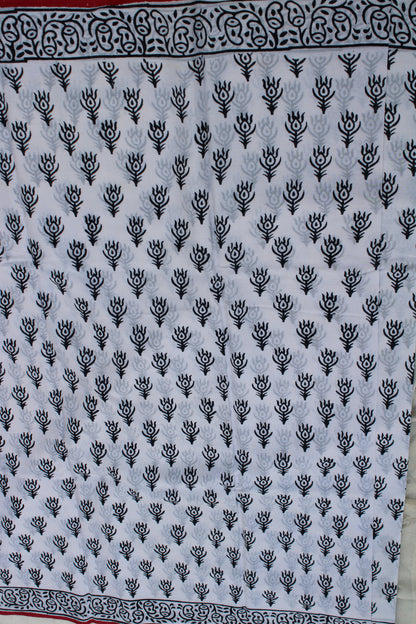 White hand block printed saree with peacock leaf design