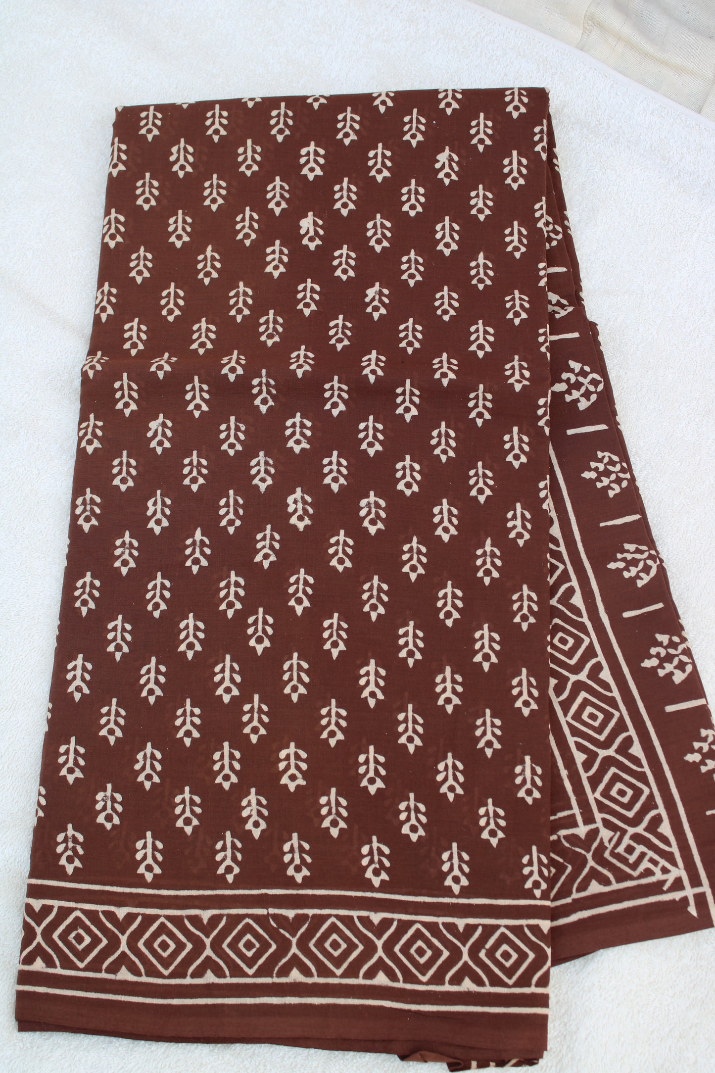 Brown with white block printed mul cotton saree