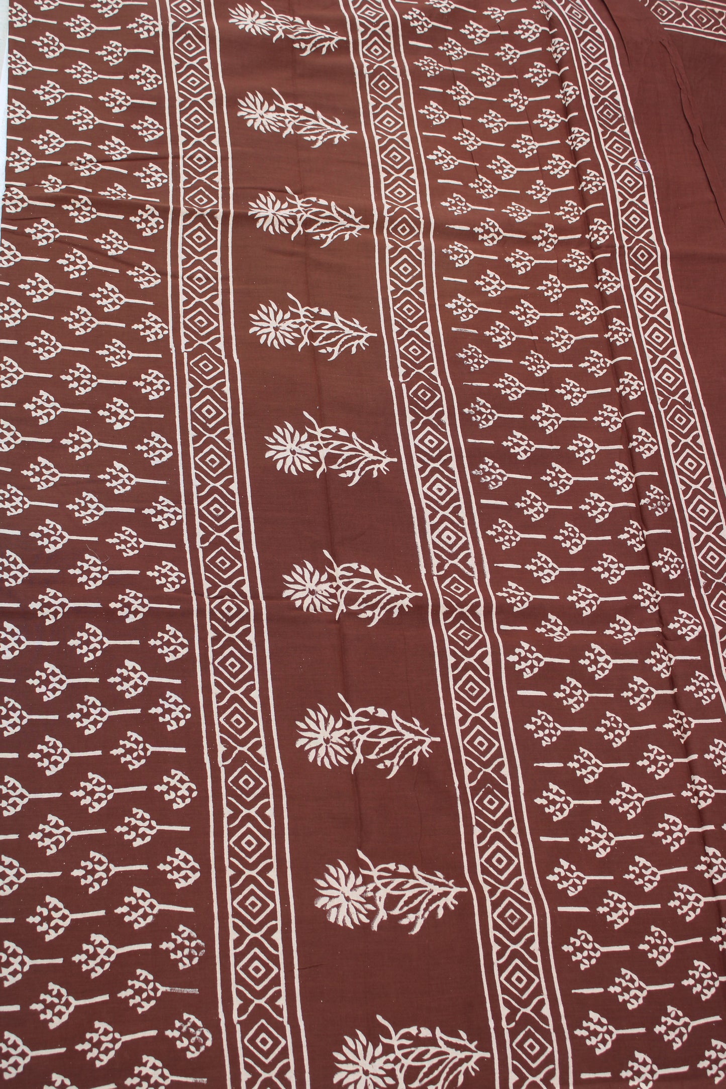 Brown with white block printed mul cotton saree