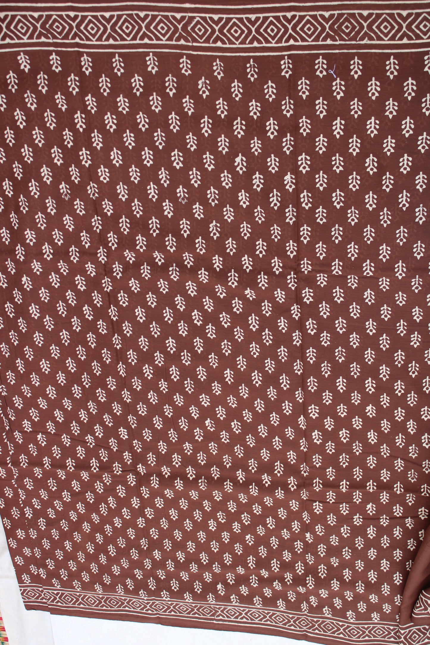 Brown with white block printed mul cotton saree