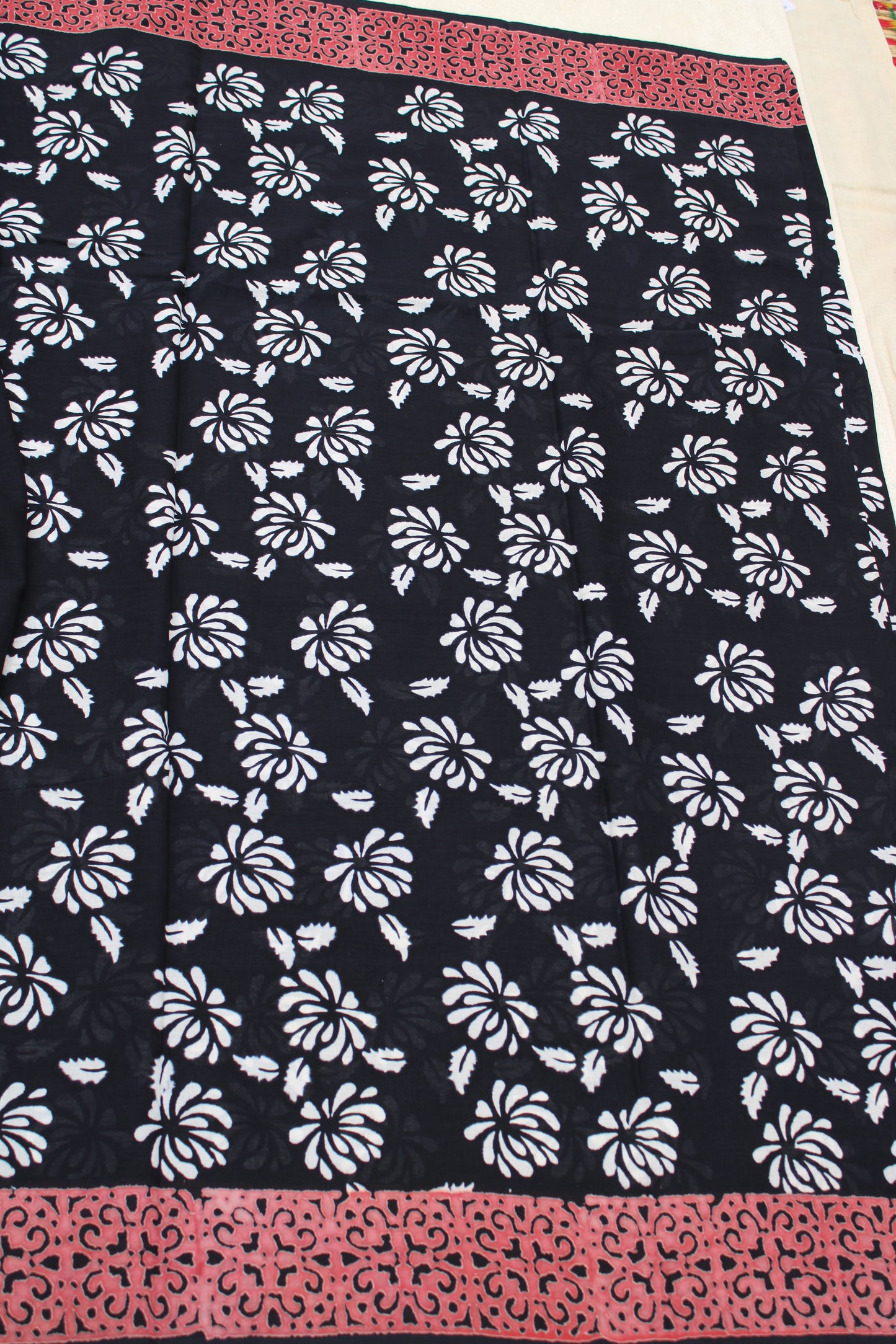 Black with white flower block printed mul cotton saree with Reb border