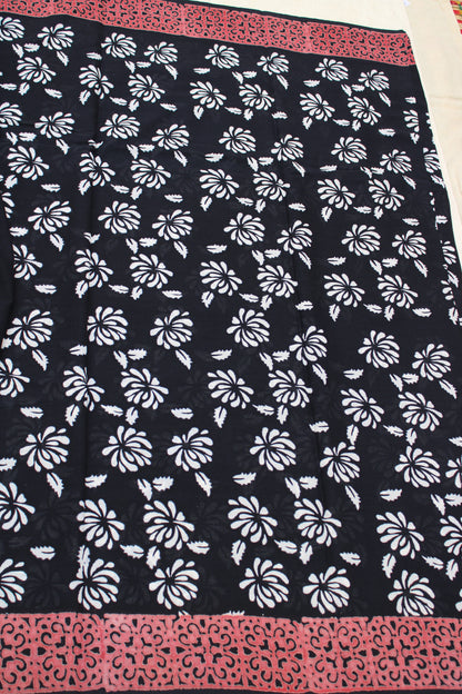 Black with white flower block printed mul cotton saree with Reb border