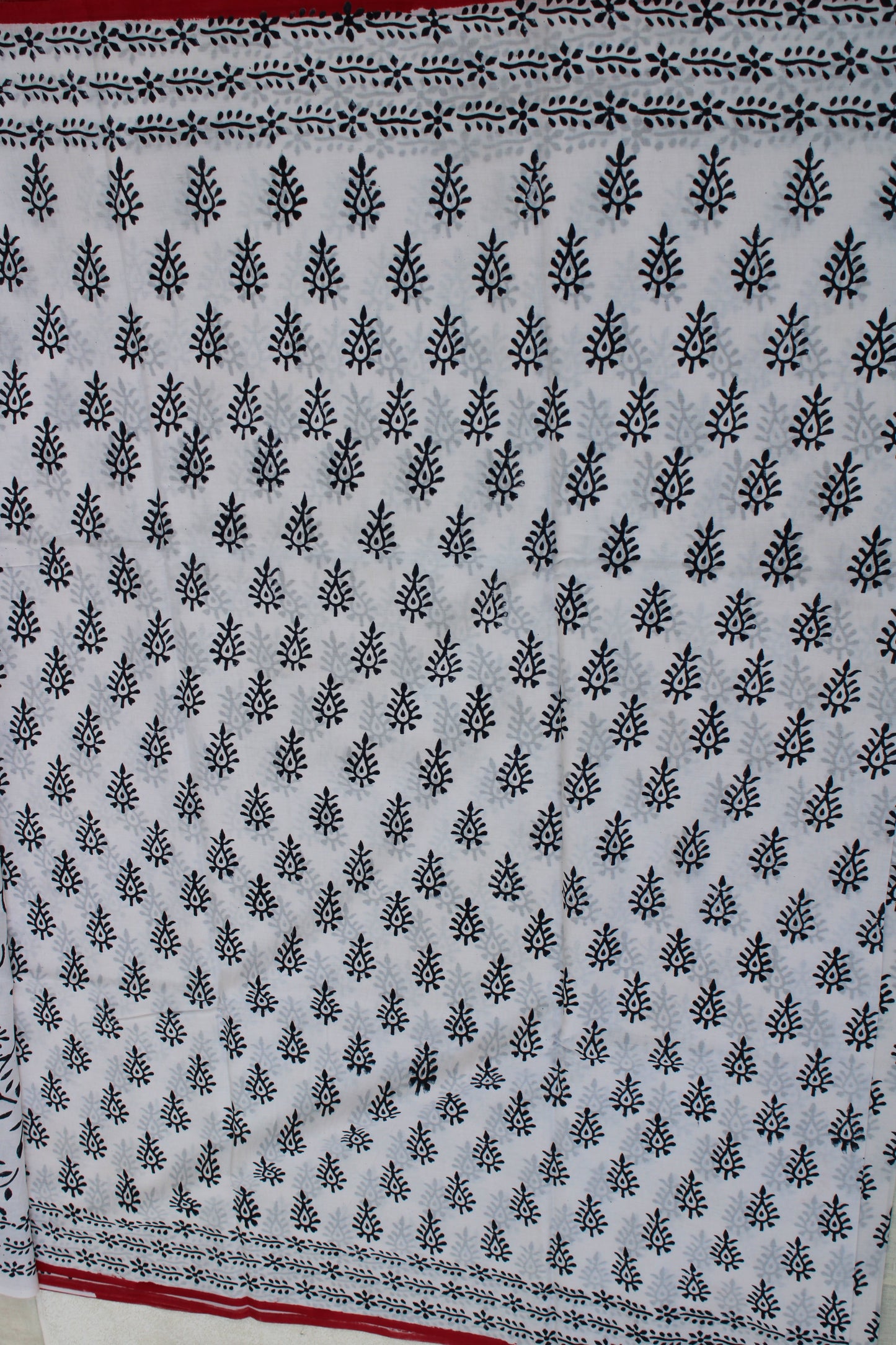 White with black peacock leaf hand block printed mul cotton saree