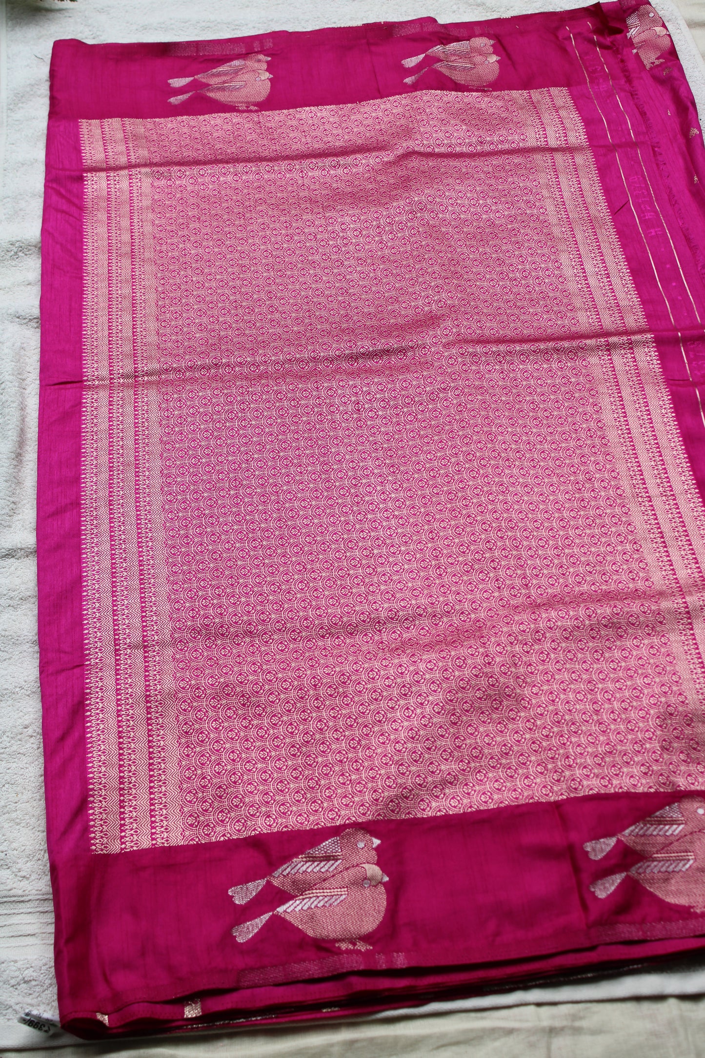 Pink Mona silk saree with figure motifs and open border
