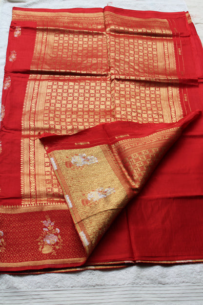 Orange Banarasi Russian crape saree with checked and floral border